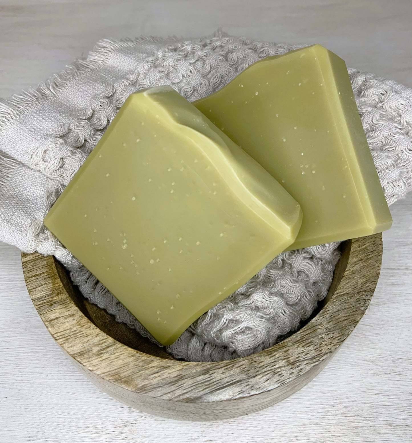 It is truly a rich and opulent bar of natural soap made with a laurel berry fruit oil known for its strong antibacterial properties. The aroma is simply enchanting – a magical blend of warm, woody, earthy, and slightly piney notes, all derived from the natural essence of laurel berry oil. What makes it even more special? No essential oils are added; it's just the pure, captivating scent of this magical oil.